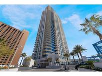 Striking high-rise with a modern design, beautiful balconies, and lush tropical landscaping at 2700 Las Vegas Blvd # 610, Las Vegas, NV 89109