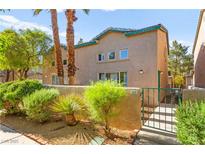 Charming townhome featuring desert landscaping, a private entrance, and a tranquil setting at 5615 Calais Ct, Las Vegas, NV 89118