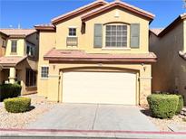 Charming two-story home featuring a two-car garage and low-maintenance landscaping at 5653 Mount Athos St, North Las Vegas, NV 89031
