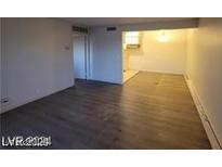View of the open living room area that flows into the kitchen at 615 S Royal Crest Cir # 10, Las Vegas, NV 89169