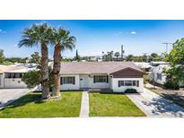 Charming single-story home with a well-maintained lawn and mature palm trees in a desirable neighborhood at 633 5Th St, Boulder City, NV 89005