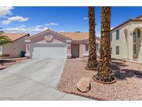 Charming single-story home with a well-maintained front yard and a two-car garage at 8316 Joseph Cary Ct, Las Vegas, NV 89145