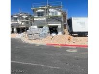 New construction home featuring scaffolding with materials delivered on-site at 8418 Sycamore Creek St, Las Vegas, NV 89113