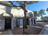 Inviting two-story townhome with well-maintained front yard and walkway at 854 Stainglass Ln, Las Vegas, NV 89110