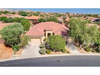 Stunning single-story home with a three-car garage, mature landscaping, and tile roof in a desirable community at 9092 National Park Dr, Las Vegas, NV 89178