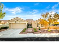 Charming single-story home with desert landscaping, tile roof, and an attached two-car garage at 10125 Hope Island Dr, Las Vegas, NV 89134