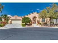 Charming single-story home featuring desert landscaping and a stylish wrought iron front door, plus an attached two-car garage at 10361 Profeta Ct, Las Vegas, NV 89135