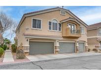 Attractive townhome featuring a private balcony and attached two-car garage at 1150 Red Margin Ct # 101, Las Vegas, NV 89183