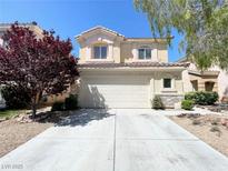 Charming two-story home features a two-car garage, well-maintained landscaping, and a welcoming facade at 180 Duck Hollow Ave, Las Vegas, NV 89148