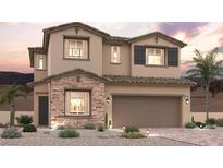 Charming two-story home featuring stone accents, a tile roof, and desert landscaping at 188 Kobuk Ave, Henderson, NV 89011