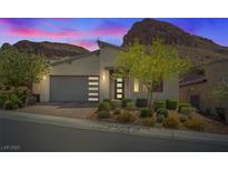 Charming single-story home featuring modern architectural design and desert landscaping at 1957 Regal Bluff Dr, Henderson, NV 89052