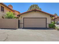Attached one car garage with a new door and direct access to the house provides convenient parking and storage at 3942 Delos Dr, Las Vegas, NV 89103