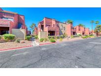 View of a modern apartment complex with beautifully landscaped grounds and inviting curb appeal at 4050 Pacific Harbors Dr # 245, Las Vegas, NV 89121