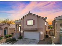 Charming two-story home with a well-maintained front yard and attached garage in a quiet neighborhood at 4507 Grotto Ct, North Las Vegas, NV 89031