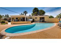Inviting backyard pool with a relaxing hot tub and covered patio area, perfect for outdoor enjoyment at 502 E Fairway Rd, Henderson, NV 89015