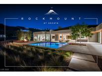 Contemporary home featuring a stunning pool, fire pit, and lush landscaping at 6 Rock Mount Ct, Henderson, NV 89012