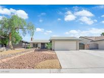 Charming single-story home with a two-car garage and low-maintenance landscaping at 6791 Greengrove Dr, Las Vegas, NV 89103