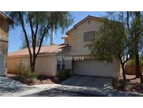 Charming two-story home featuring a tiled roof, desert landscaping, and an attached two-car garage at 7518 Luna Del Rey St, Las Vegas, NV 89123