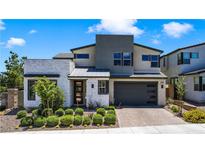 Stunning two-story modern home with stone accents, well-manicured landscaping, and a spacious two-car garage at 10297 Sierra Skye Ave, Las Vegas, NV 89166