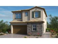 Charming two-story home featuring desert landscaping, a two car garage, and a stone facade at 103 Tardando Ave, Henderson, NV 89015