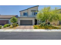 Contemporary two-story home featuring a two-car garage and modern landscaping at 1321 Hudson Creek Pl, North Las Vegas, NV 89084