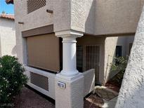 Beige exterior with porch and security door in front of unit #1407 A at 1407 Santa Margarita St # A, Las Vegas, NV 89146