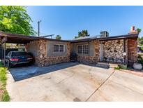 Charming single-story home with stone and brick accents, plus a covered parking area in front at 201 Cervantes St, Las Vegas, NV 89101
