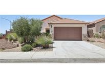 Charming single-story home with desert landscaping and a spacious two-car garage at 2284 Carambala Ln, Henderson, NV 89044