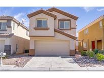 Charming two-story home with a two-car garage and well-maintained landscaping at 236 Dog Leg Dr, Las Vegas, NV 89148