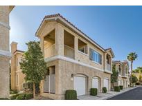 Charming condo building with stucco exterior, private balconies and attached garages at 251 S Green Valley Pkwy # 2821, Henderson, NV 89012