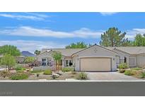 Charming single-story home with desert landscaping and a two-car garage at 2601 Harrisburg Ave, Henderson, NV 89052