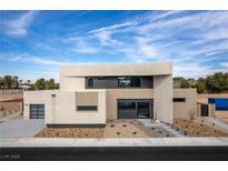 Contemporary two-story home boasts sleek design, desert landscaping, and a two-car garage at 3510 Cosima Ln, Las Vegas, NV 89120