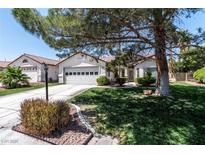 Charming single-story home featuring a two-car garage, well-manicured lawn, and mature shade tree at 4904 Wiltondale Way, Las Vegas, NV 89130
