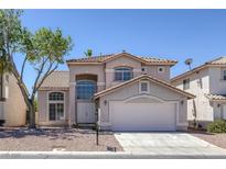Charming two-story home featuring desert landscaping and a tile roof at 829 Dancing Vines Ave, Las Vegas, NV 89183