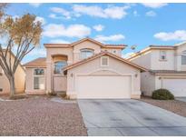 Charming two-story home featuring an attached two-car garage and a xeriscaped front yard for low maintenance at 829 Dancing Vines Ave, Las Vegas, NV 89183
