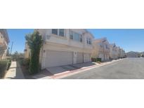 Charming townhome featuring two stories with two-car garage in a well-maintained community at 9322 Straw Hays St # 103, Las Vegas, NV 89178