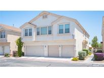 Charming multi-Gathering home featuring a three-car garage and stucco facade in a residential community at 9322 Straw Hays St # 103, Las Vegas, NV 89178