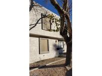 Two story residential building showcasing a neutral stucco exterior with rectangular framed windows and decorative rock landscaping at 1336 N Jones Blvd, Las Vegas, NV 89108