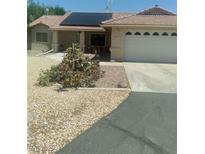 Charming single-story home featuring solar panels and a xeriscaped front yard for low maintenance at 1611 Red Rock Dr, Pahrump, NV 89048