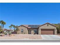 Charming single-story home with desert landscaping, solar panels, and a two-car garage at 2320 Anderson Park Dr, Henderson, NV 89044