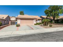 Charming single-story home featuring a well-maintained front yard and a two-car garage at 259 Baring Cross St, Henderson, NV 89074