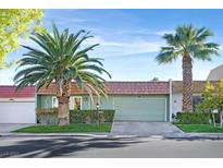 Charming single-story home featuring desert landscaping, a tile roof, and an attached two-car garage at 3753 Heritage Ave, Las Vegas, NV 89121
