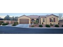 Charming single-story home with well-manicured landscaping and an attached two-car garage at 4242 Helena Hideaway Ct, Las Vegas, NV 89129