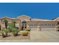 Charming single-story home with desert landscaping and a spacious three-car garage at 467 Beardsley Cir, Henderson, NV 89052