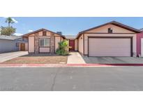Charming single-story home with a two-car garage and low-maintenance landscaping at 4735 Madrigal Way, Las Vegas, NV 89122
