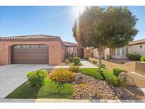 Charming home featuring well-manicured landscaping and a spacious two-car garage at 5745 Sagamore Canyon St, North Las Vegas, NV 89081