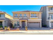 Charming two-story home featuring a tile roof, neutral stucco, and attached two-car garage at 10598 Aphrodite St, Las Vegas, NV 89183
