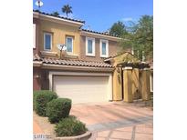 Charming townhome with a two-car garage and inviting curb appeal at 11 Cerchio Basso, Henderson, NV 89011