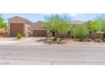 Charming single-story home with desert landscaping, stone accents, and a spacious three-car garage at 245 Hull St, Henderson, NV 89015