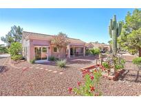 Inviting home featuring desert landscaping, mature trees, and a covered patio for outdoor enjoyment at 3013 Sungold Dr, Las Vegas, NV 89134